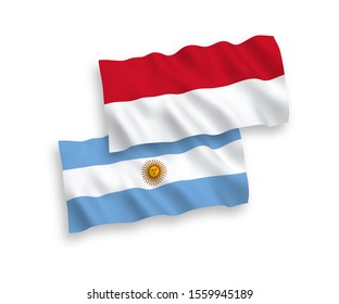 National vector fabric wave flags of Indonesia and Argentina isolated on white background. 1 to 2 proportion.