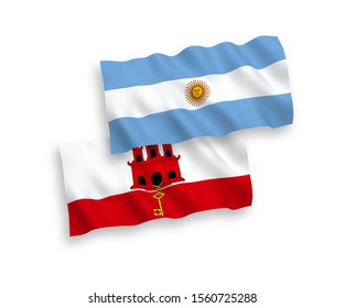 National vector fabric wave flags of Argentina and Gibraltar isolated on white background. 1 to 2 proportion.