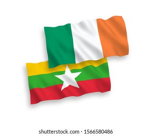 National vector fabric wave flags of Ireland and Myanmar isolated on white background. 1 to 2 proportion.