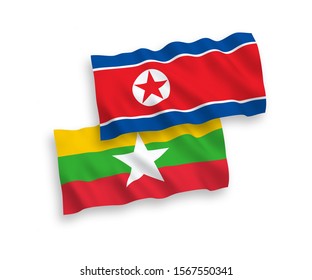 National vector fabric wave flags of North Korea and Myanmar isolated on white background. 1 to 2 proportion.