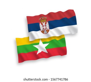 National vector fabric wave flags of Myanmar and Serbia isolated on white background. 1 to 2 proportion.