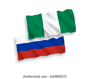 National vector fabric wave flags of Nigeria and Russia isolated on white background. 1 to 2 proportion.