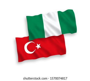 National vector fabric wave flags of Turkey and Nigeria isolated on white background. 1 to 2 proportion.