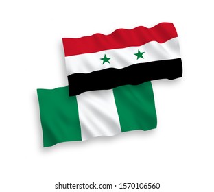 National vector fabric wave flags of Nigeria and Syria isolated on white background. 1 to 2 proportion.