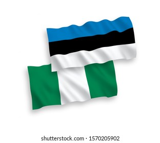 National vector fabric wave flags of Estonia and Nigeria isolated on white background. 1 to 2 proportion.