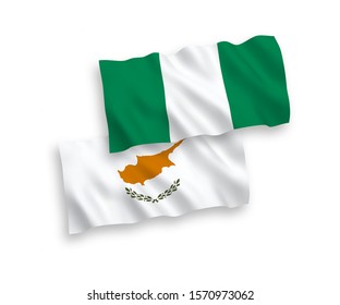 National vector fabric wave flags of Cyprus and Nigeria isolated on white background. 1 to 2 proportion.