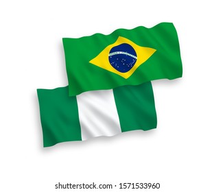 National vector fabric wave flags of Brazil and Nigeria isolated on white background. 1 to 2 proportion.
