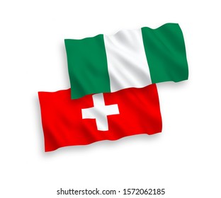 National vector fabric wave flags of Nigeria and Switzerland isolated on white background. 1 to 2 proportion.