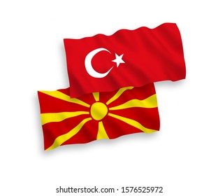 National vector fabric wave flags of Turkey and North Macedonia isolated on white background. 1 to 2 proportion.