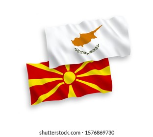 National vector fabric wave flags of Cyprus and North Macedonia isolated on white background. 1 to 2 proportion.