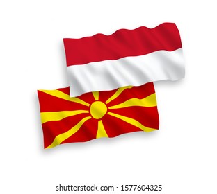 National vector fabric wave flags of Indonesia and North Macedonia isolated on white background. 1 to 2 proportion.