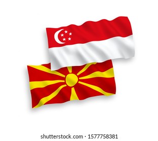 National vector fabric wave flags of North Macedonia and Singapore isolated on white background. 1 to 2 proportion.