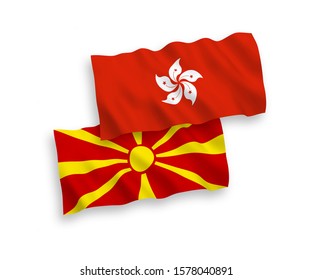National vector fabric wave flags of North Macedonia and Hong Kong isolated on white background. 1 to 2 proportion.