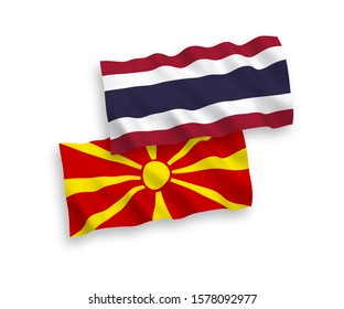 National vector fabric wave flags of North Macedonia and Thailand isolated on white background. 1 to 2 proportion.