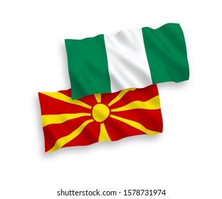 National vector fabric wave flags of North Macedonia and Nigeria isolated on white background. 1 to 2 proportion.