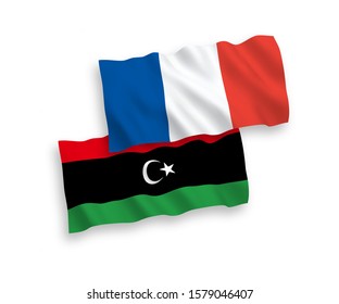 National vector fabric wave flags of France and Libya isolated on white background. 1 to 2 proportion.