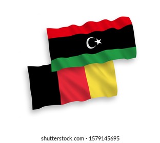 National vector fabric wave flags of Libya and Belgium isolated on white background. 1 to 2 proportion.