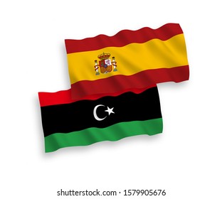National vector fabric wave flags of Libya and Spain isolated on white background. 1 to 2 proportion.