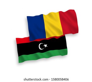 National vector fabric wave flags of Romania and Libya isolated on white background. 1 to 2 proportion.