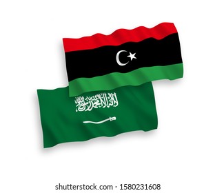 National vector fabric wave flags of Saudi Arabia and Libya isolated on white background. 1 to 2 proportion.