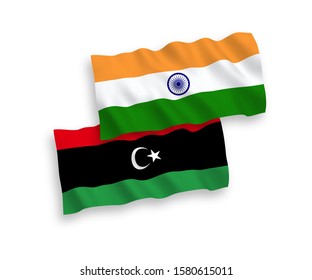 National vector fabric wave flags of India and Libya isolated on white background. 1 to 2 proportion.