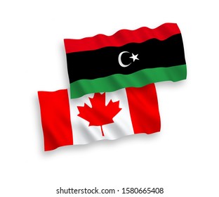 National vector fabric wave flags of Canada and Libya isolated on white background. 1 to 2 proportion.