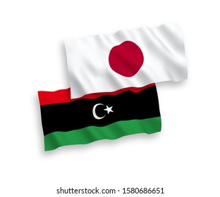 National vector fabric wave flags of Japan and Libya isolated on white background. 1 to 2 proportion.