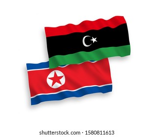 National vector fabric wave flags of North Korea and Libya isolated on white background. 1 to 2 proportion.