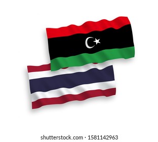 National vector fabric wave flags of Libya and Thailand isolated on white background. 1 to 2 proportion.