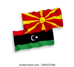 National vector fabric wave flags of Libya and North Macedonia isolated on white background. 1 to 2 proportion.