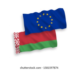 National vector fabric wave flags of European Union and Belarus isolated on white background. 1 to 2 proportion.