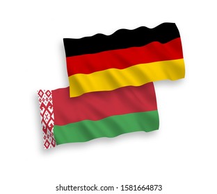 National vector fabric wave flags of Germany and Belarus isolated on white background. 1 to 2 proportion.