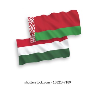 National vector fabric wave flags of Belarus and Hungary isolated on white background. 1 to 2 proportion.