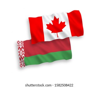 National vector fabric wave flags of Canada and Belarus isolated on white background. 1 to 2 proportion.