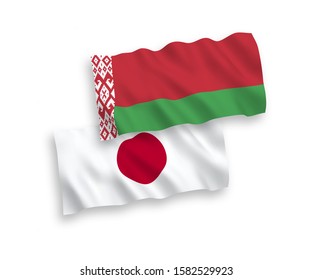 National vector fabric wave flags of Japan and Belarus isolated on white background. 1 to 2 proportion.