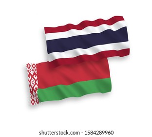 National vector fabric wave flags of Belarus and Thailand isolated on white background. 1 to 2 proportion.
