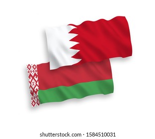 National vector fabric wave flags of Belarus and Bahrain isolated on white background. 1 to 2 proportion.