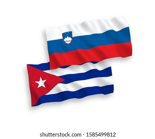 National vector fabric wave flags of Slovenia and Cuba isolated on white background. 1 to 2 proportion.