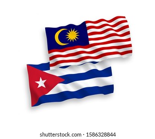 National vector fabric wave flags of Cuba and Malaysia isolated on white background. 1 to 2 proportion.