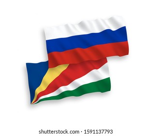 National vector fabric wave flags of Seychelles and Russia isolated on white background. 1 to 2 proportion.