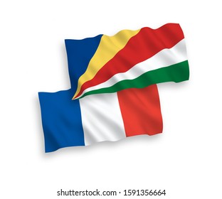 National vector fabric wave flags of France and Seychelles isolated on white background. 1 to 2 proportion.