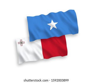 National vector fabric wave flags of Malta and Somalia isolated on white background. 1 to 2 proportion.