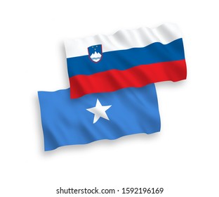 National vector fabric wave flags of Slovenia and Somalia isolated on white background. 1 to 2 proportion.