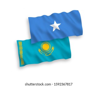 National vector fabric wave flags of Kazakhstan and Somalia isolated on white background. 1 to 2 proportion.