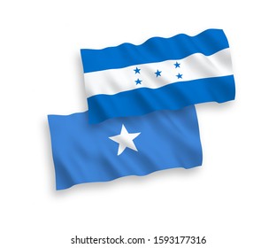 National vector fabric wave flags of Somalia and Honduras isolated on white background. 1 to 2 proportion.