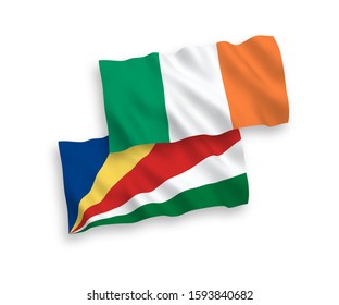 National vector fabric wave flags of Ireland and Seychelles isolated on white background. 1 to 2 proportion.