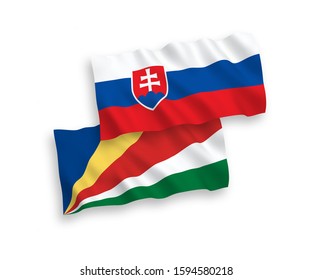 National vector fabric wave flags of Slovakia and Seychelles isolated on white background. 1 to 2 proportion.