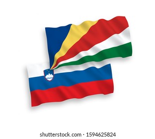 National vector fabric wave flags of Slovenia and Seychelles isolated on white background. 1 to 2 proportion.