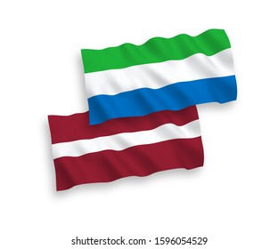 National vector fabric wave flags of Latvia and Sierra Leone isolated on white background. 1 to 2 proportion.