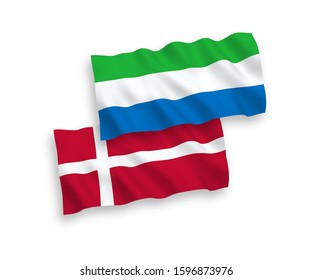 National vector fabric wave flags of Denmark and Sierra Leone isolated on white background. 1 to 2 proportion.